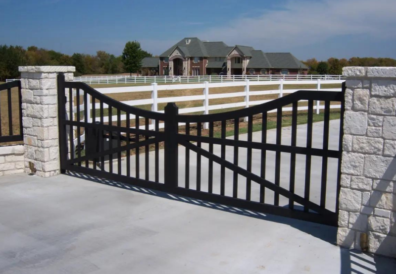 Decorative metal gate for modern driveway and home.