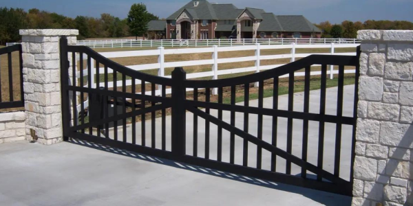 Decorative metal gate for modern driveway and home.