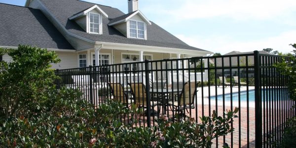 Ornamental Iron fence surrounding home perimeter